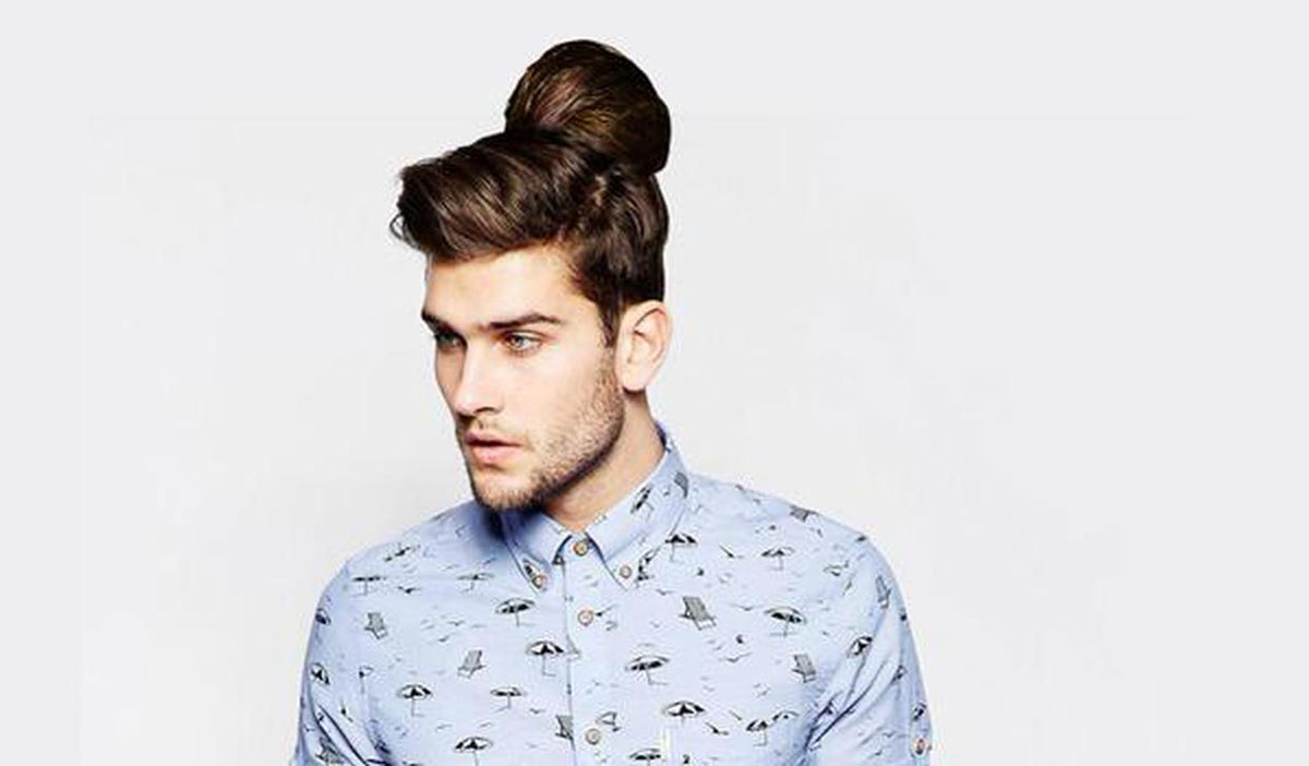 A male model wearing a clip-on man bun for ASOS' April Fool's Day prank.
