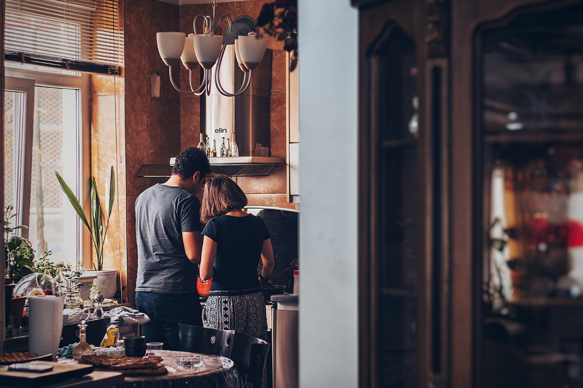 A man and woman in the kitchen