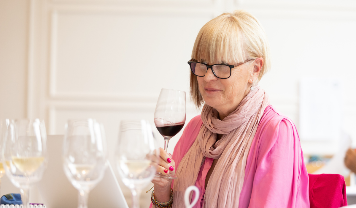 A woman tasting wine