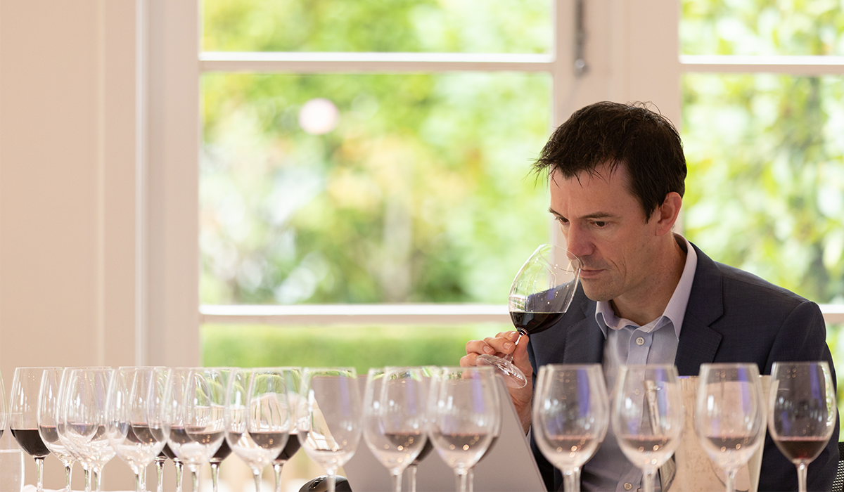 Tyson Stelzer, tasting a selection of wines, and smelling a red wine