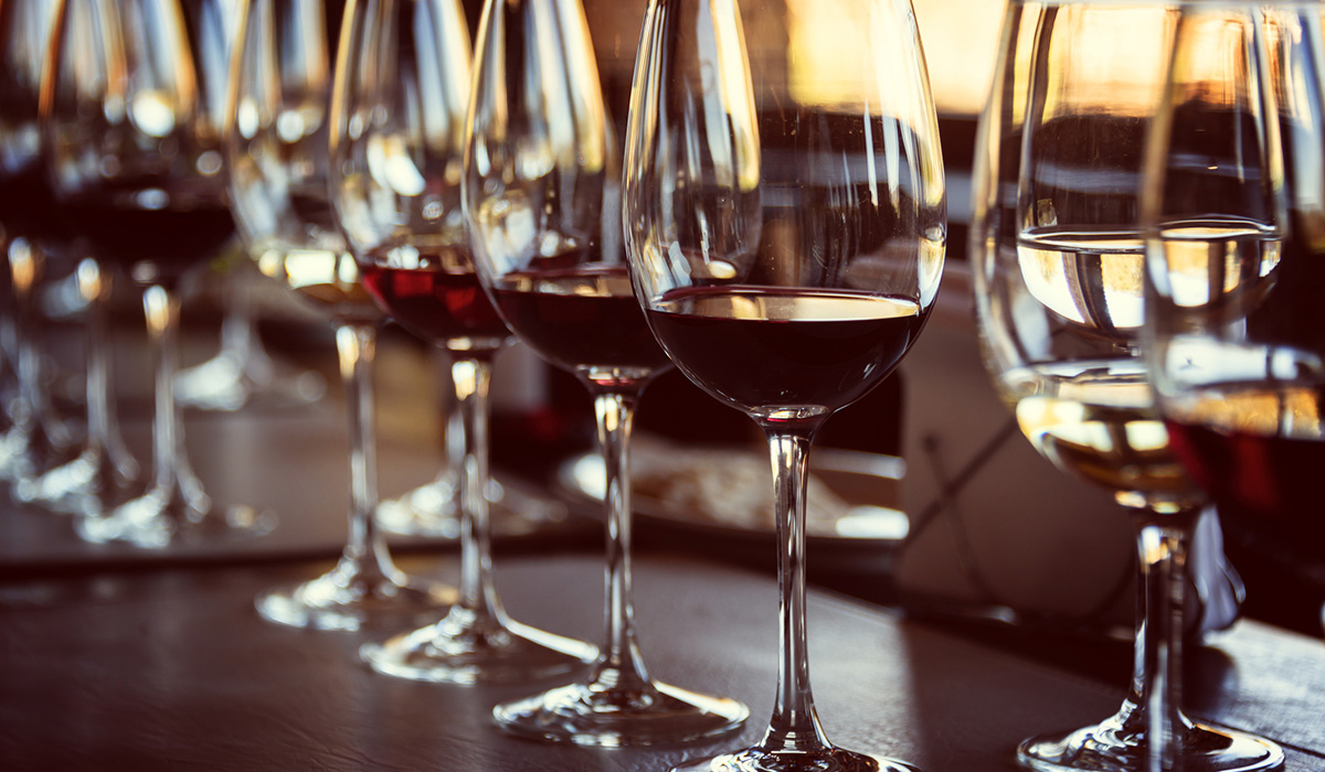 Close up of glasses of wine, such as cabernet, on a table during a wine tasting