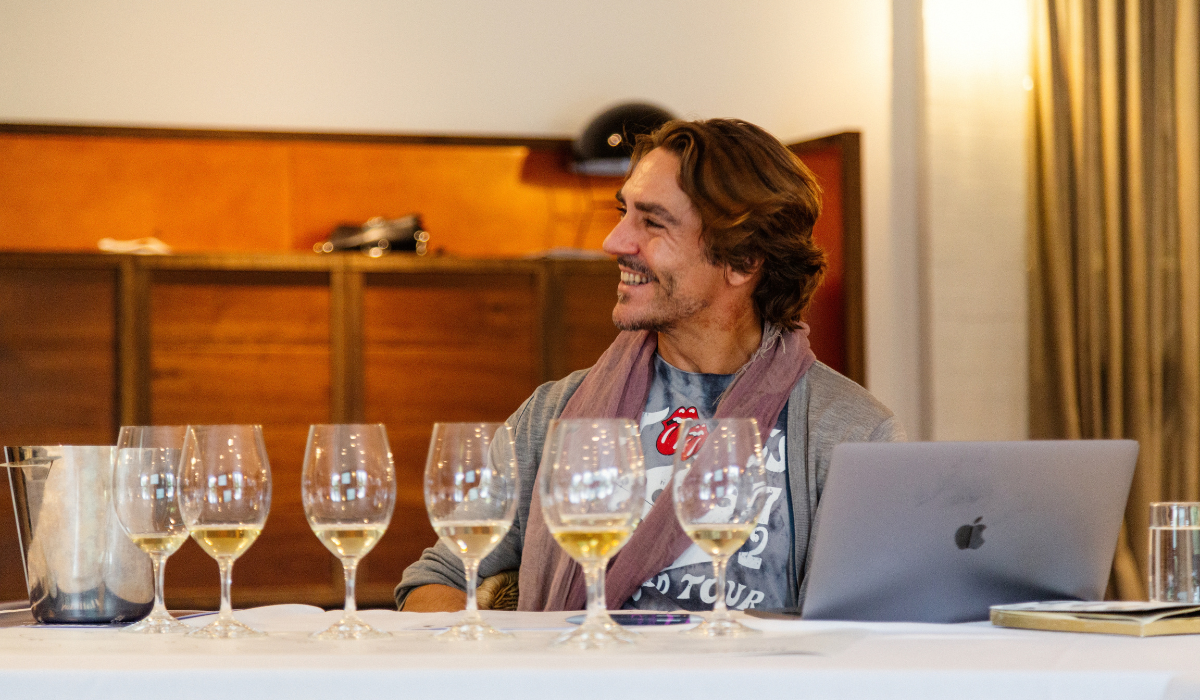 A professional wine taster at a white wine tasting