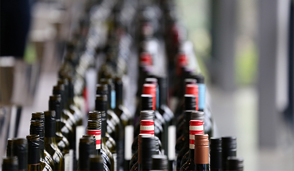 Hundreds of bottles of wine lined up