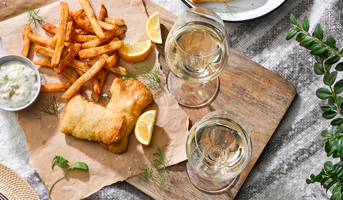 Fish and chips, view from above, with sauvignon blanc