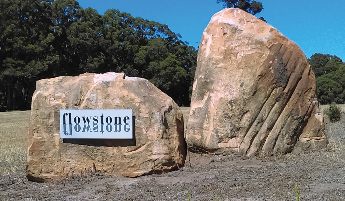 Flowstone sign on boulders
