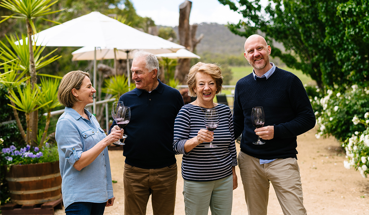 Four people drinking wine in Sanguine estate