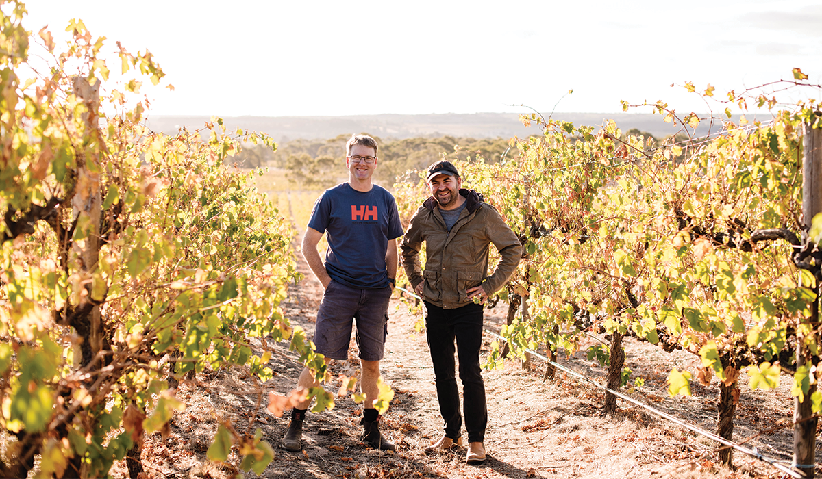 Two men standing in Hither & Yon vineyard