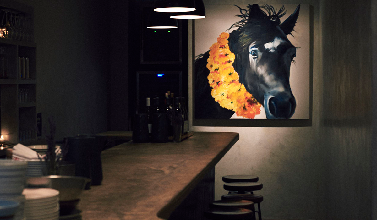 Ruffian bar, with a painting of a horse on the wall
