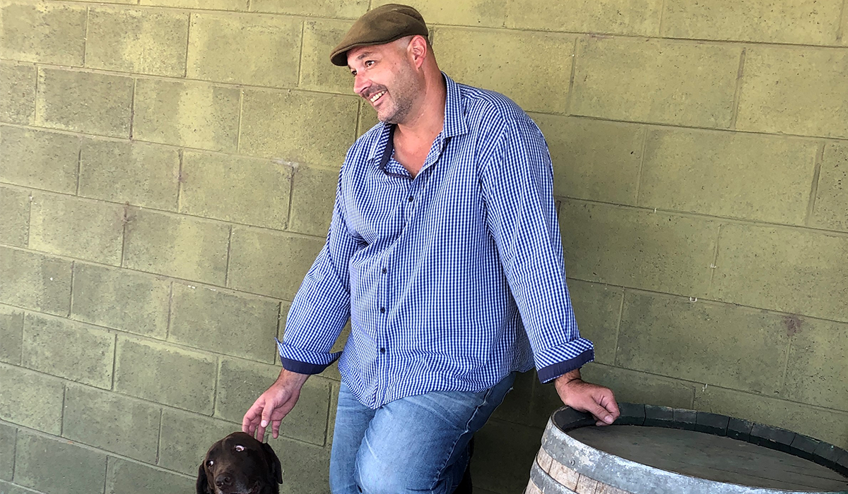 Vindana winemaker patting dog