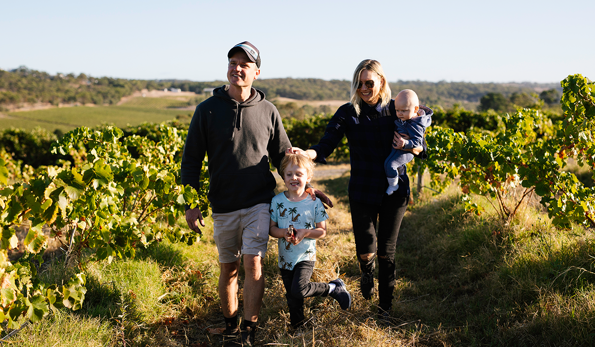 Bondar owners in the vineyard with their two children