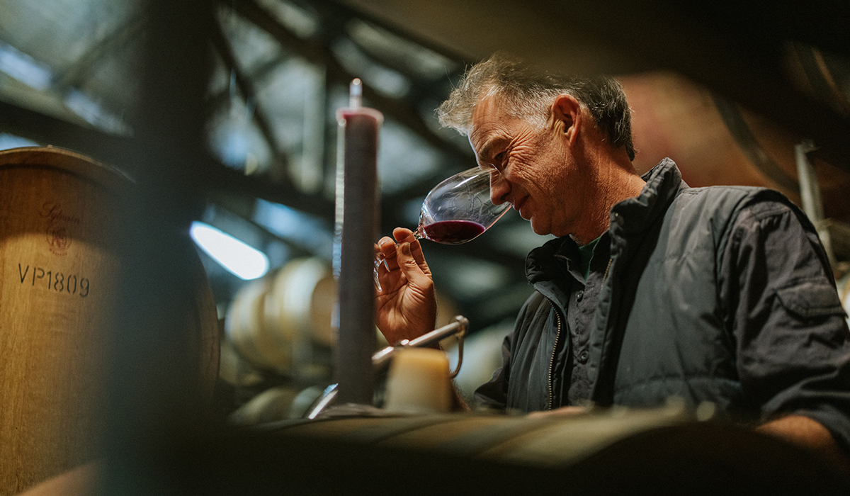 Mark Messenger, Juniper Estate, tasting a glass of red wine