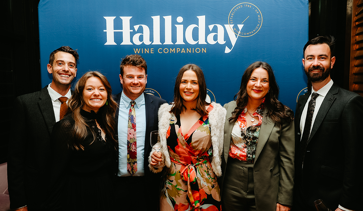 Winners in front of a Halliday banner at the 2023 Halliday Awards