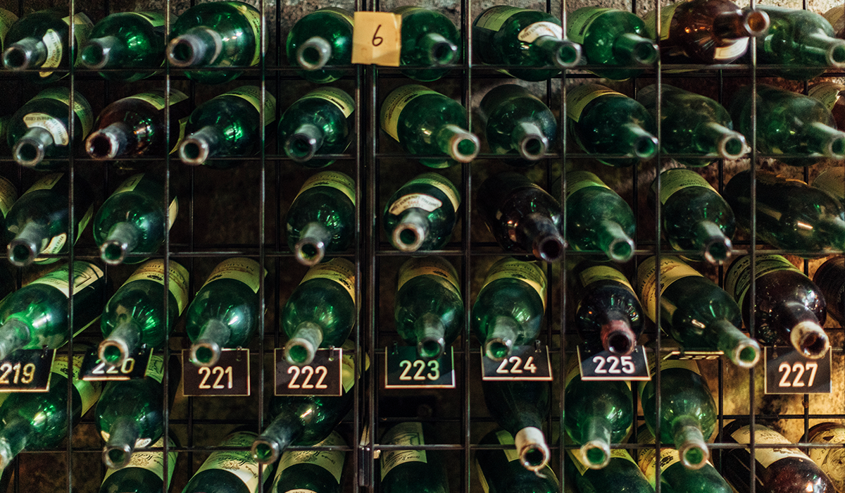 Bottles in a rack in a cellar