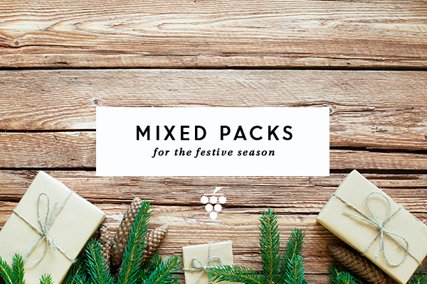 Mixed packs - presents wrapped in brown paper and string surrounded by pine leaves
