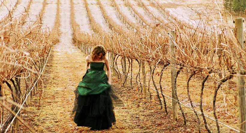 Rosby wines - girl in dress in a vineyard